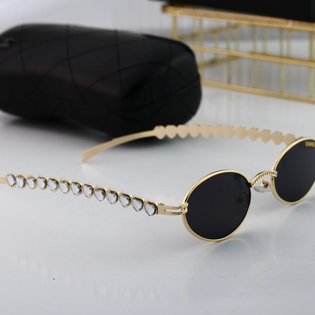 Lunettes de soleil vintage en forme d'œuf avec strass en forme de cœur