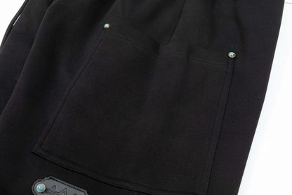 Pantalones cortos con detalle de hebilla turquesa