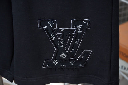 Pantalones cortos con apliques de pétalos