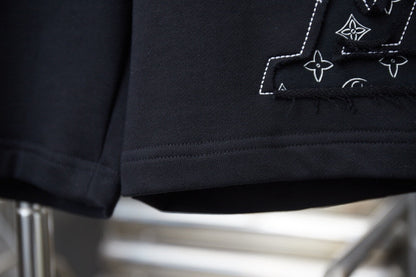 Pantalones cortos con apliques de pétalos